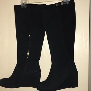 Black above the knee length boots